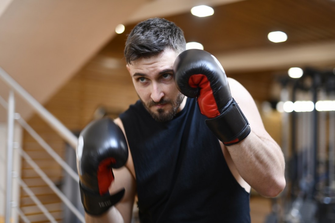 Practicing head movement drills while shadow boxing.