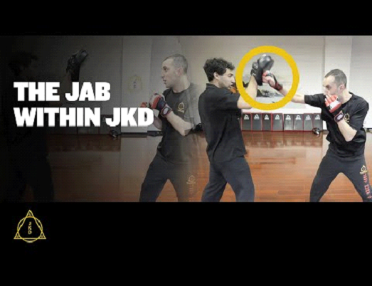 A martial artist demonstrates a JKD jab.