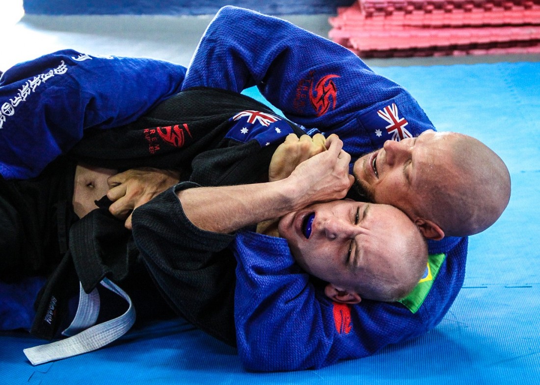 Rear choke during a martial arts competition.