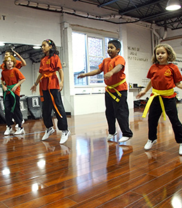 Children doing warmups for fitness at NY Martial Arts Academy