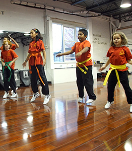 Children doing warmups for fitness at NY Martial Arts Academy